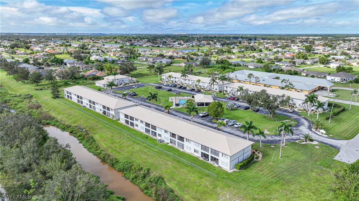 26485 Rampart Boulevard, Unit A6 Punta Gorda, FL 33983 - Photo 30 of 32 a view of a city with a building in the background
