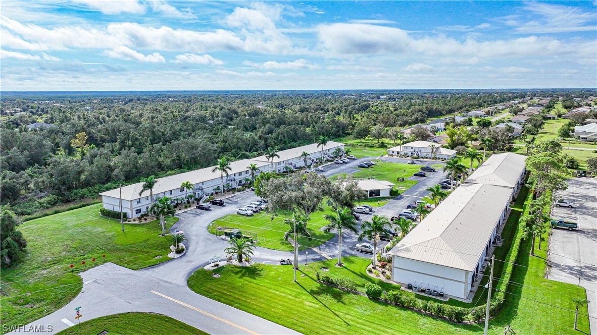 26485 Rampart Boulevard, Unit A6 Punta Gorda, FL 33983 - Photo 3 of 32 an aerial view of a house with a garden