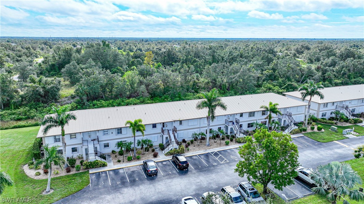 26485 Rampart Boulevard, Unit A6 Punta Gorda, FL 33983 - Photo 32 of 32 an aerial view of a house with a garden