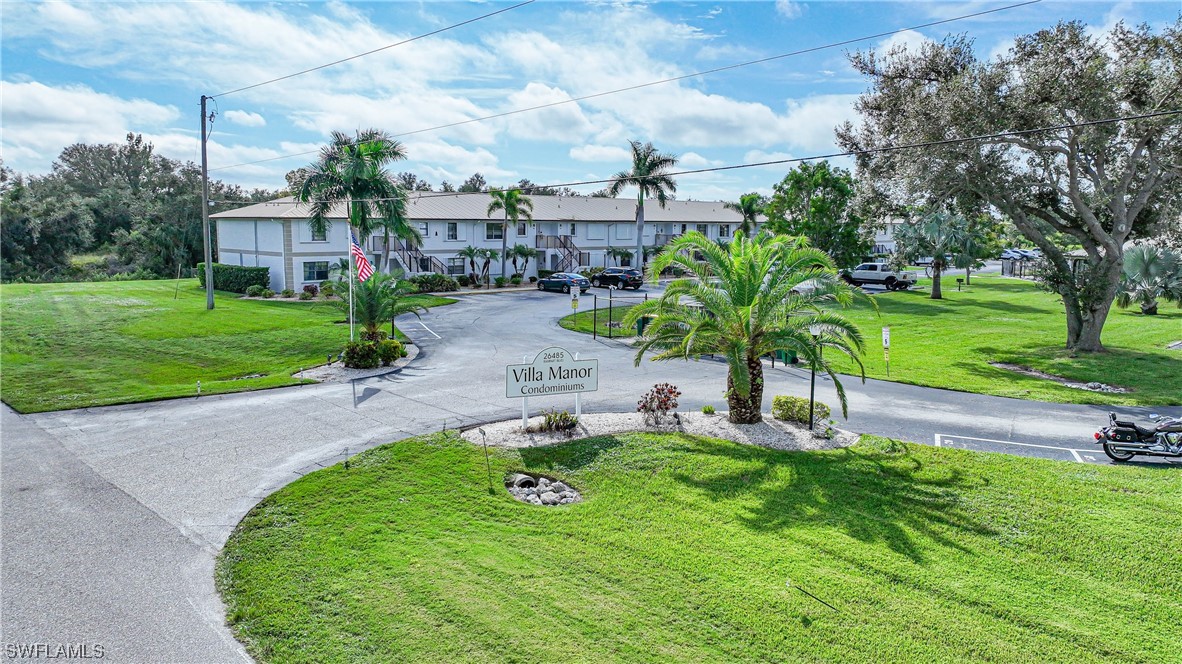 26485 Rampart Boulevard, Unit A6 Punta Gorda, FL 33983 - Photo 6 of 32 a view of a garden with a house