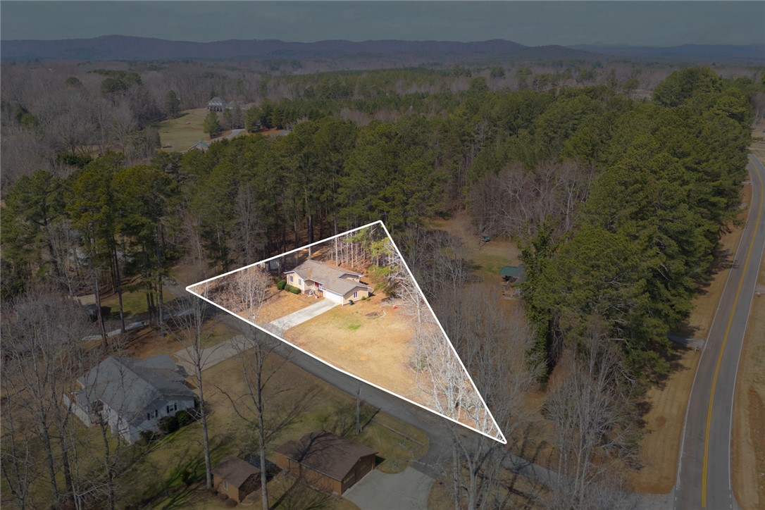 308 Wildwood Road Walhalla, SC 29691 - Photo 20 of 23 Perched on a verdant lot, this charming residence offers a peaceful retreat surrounded by nature's beauty.