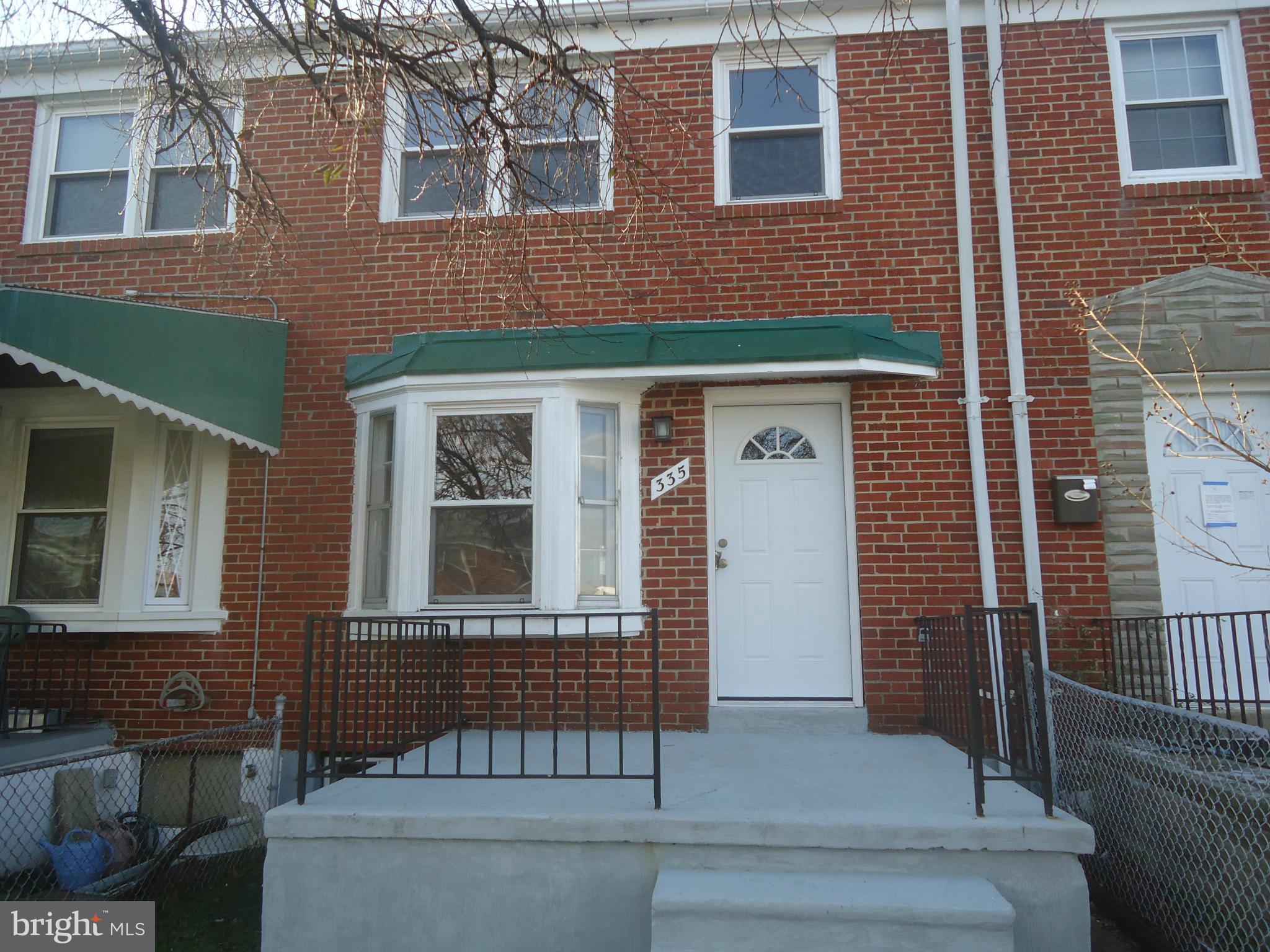 335 Torner Road Essex, MD 21221 - Photo 1 of 14 a view of a brick house with many windows