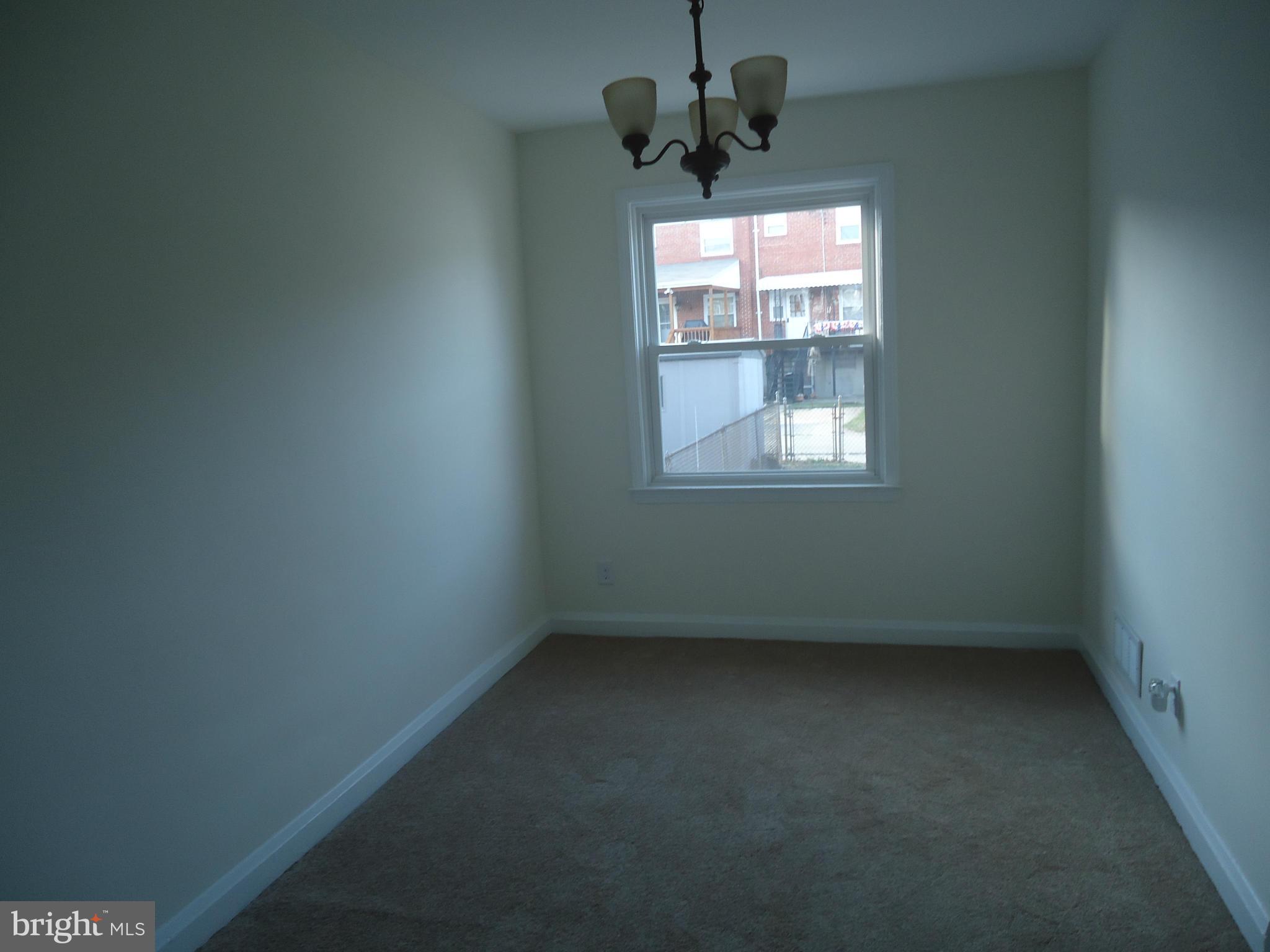 335 Torner Road Essex, MD 21221 - Photo 2 of 14 an empty room with a window