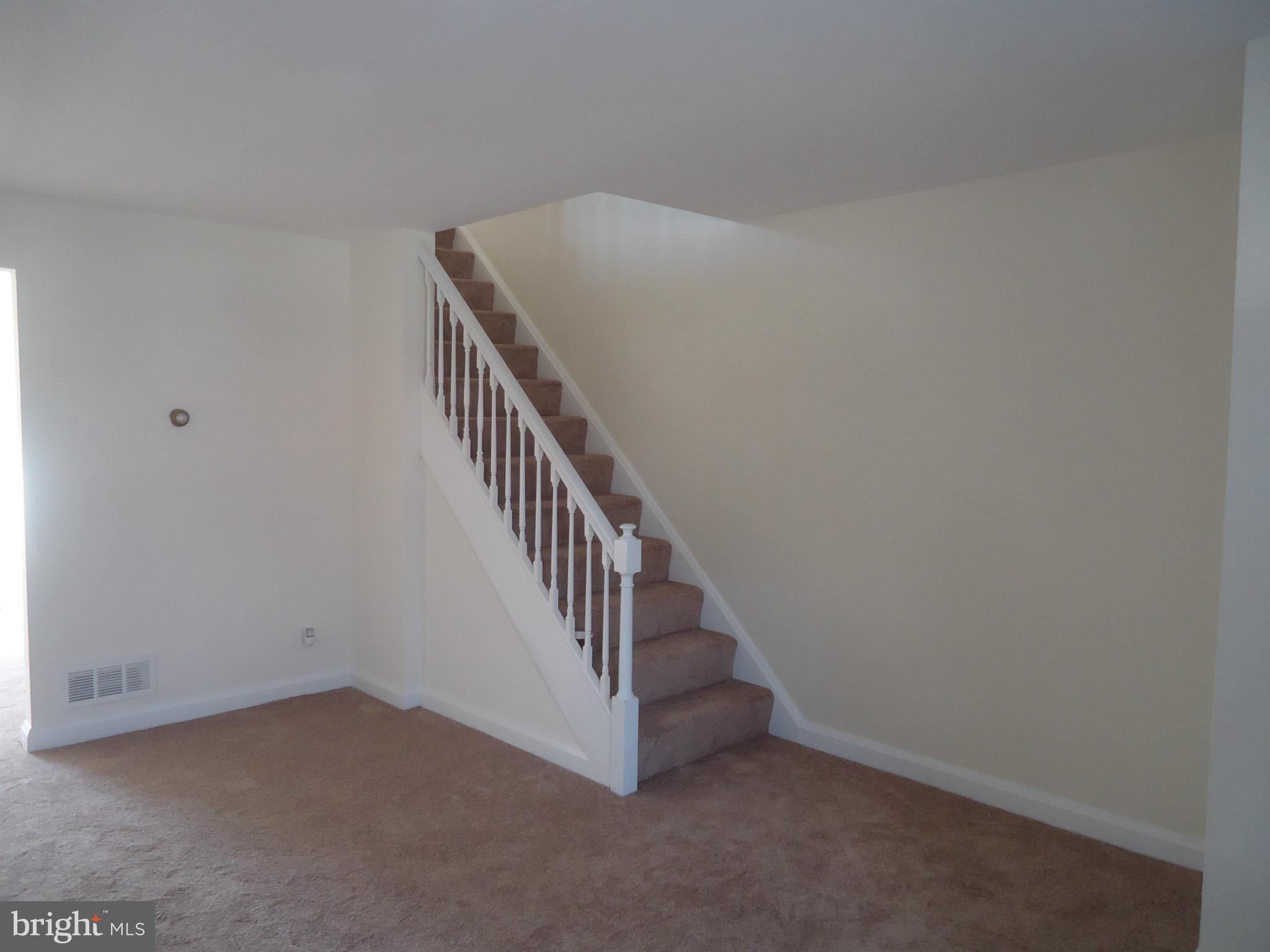 335 Torner Road Essex, MD 21221 - Photo 11 of 14 a view of a hallway with staircase