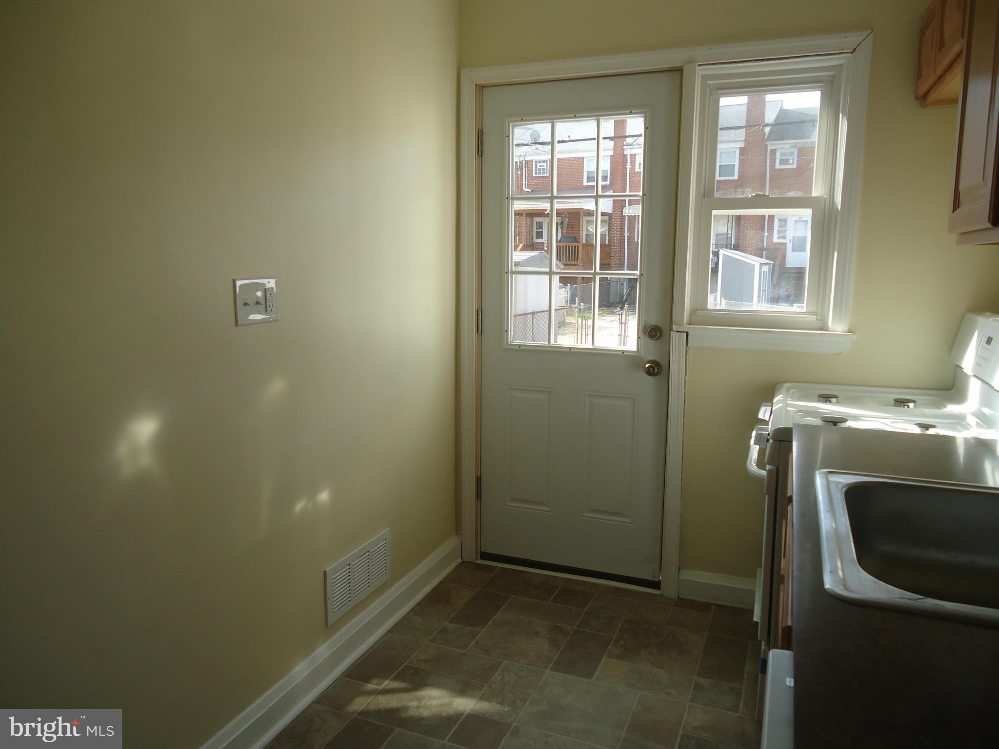 335 Torner Road Essex, MD 21221 - Photo 14 of 14 a bathroom with a sink and a window