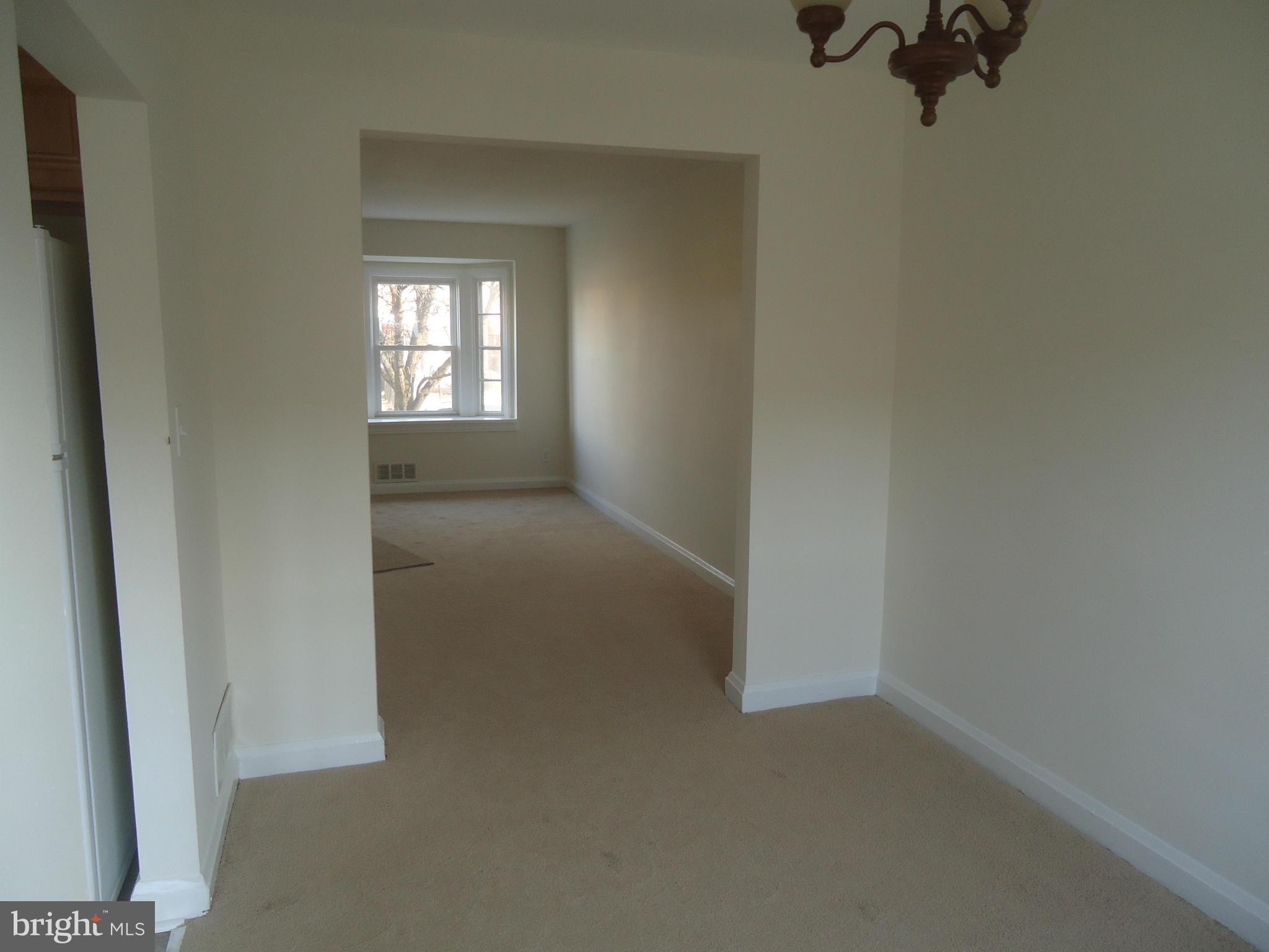 335 Torner Road Essex, MD 21221 - Photo 3 of 14 an empty room with a window