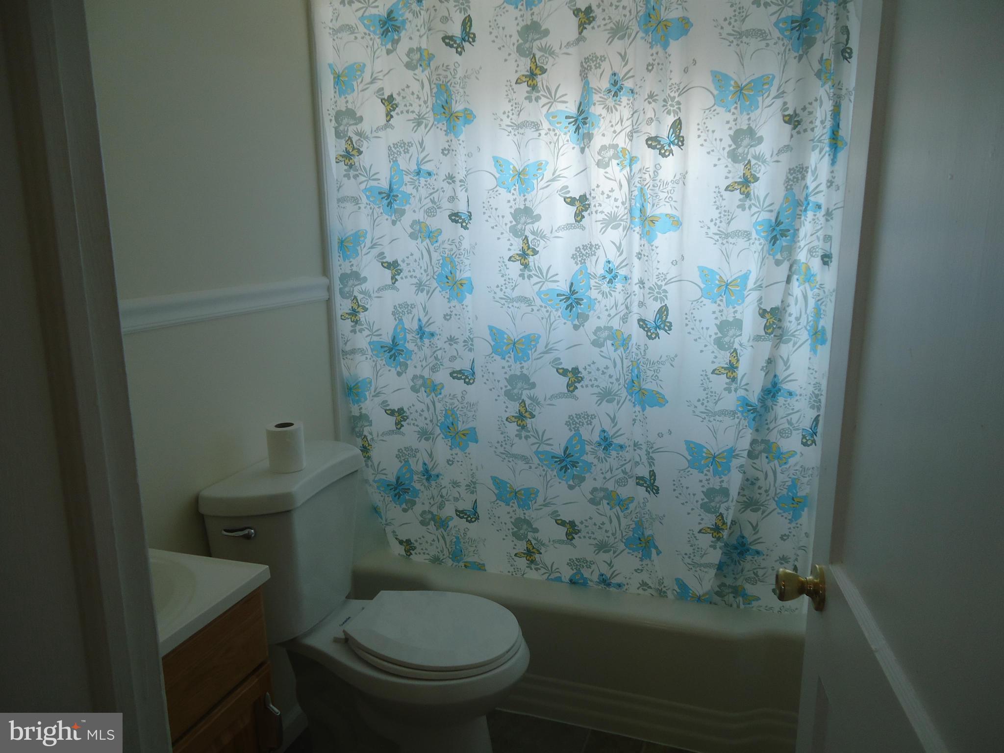 335 Torner Road Essex, MD 21221 - Photo 4 of 14 a bathroom with a toilet and a shower