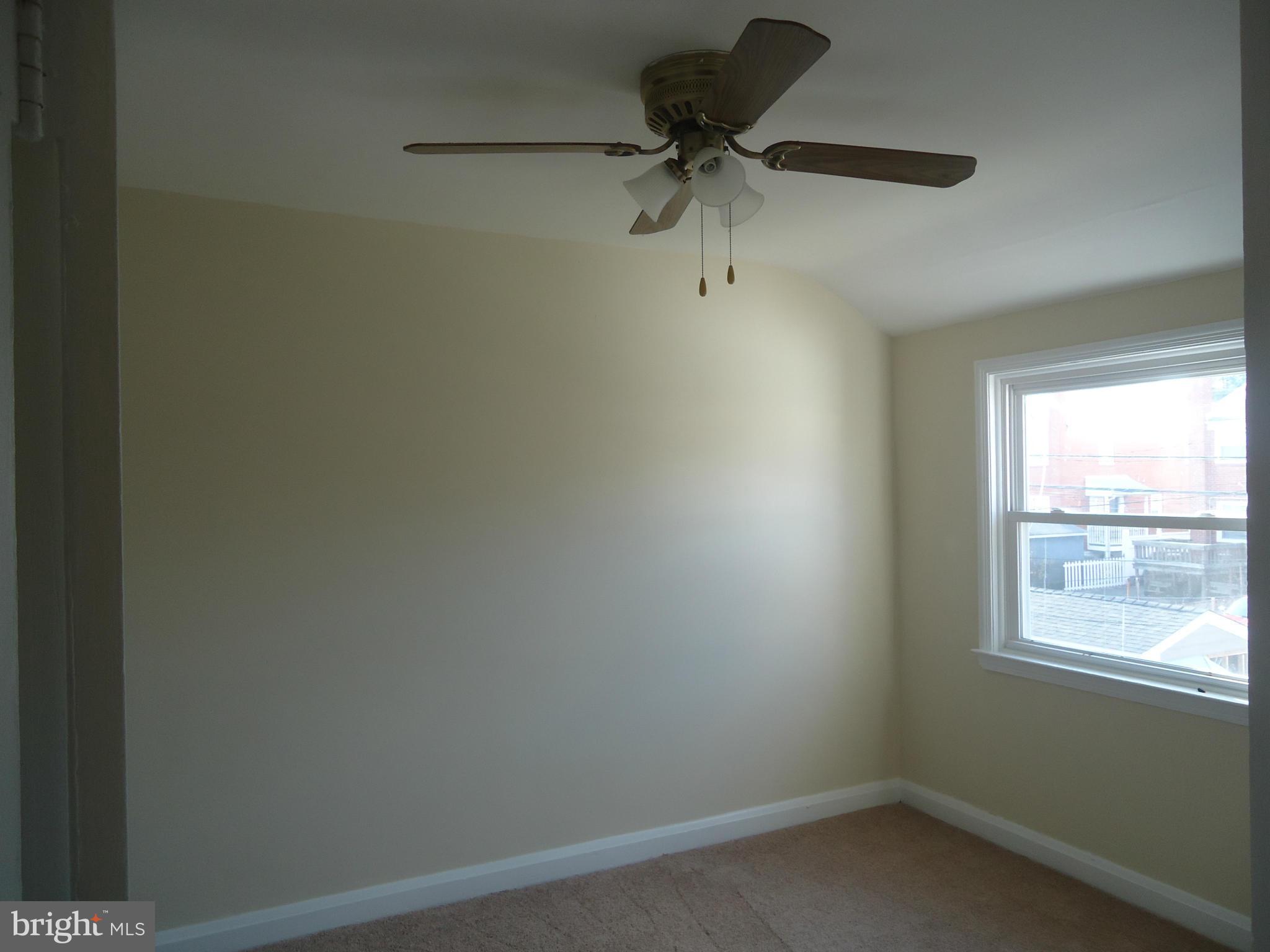 335 Torner Road Essex, MD 21221 - Photo 5 of 14 an empty room with a window