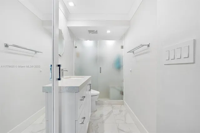 a bathroom with a sink and shower