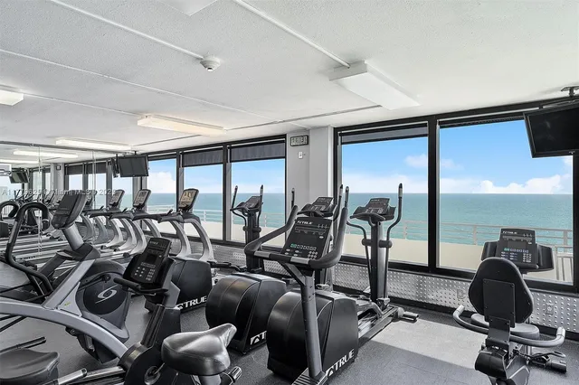 a group of people sitting on a table and chairs in patio