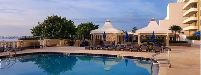 a view of swimming pool with a yard