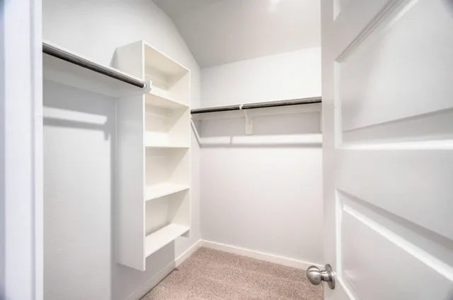 a view of an empty walk in closet