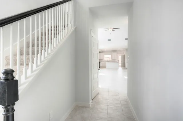 a view of hallway with wooden floor