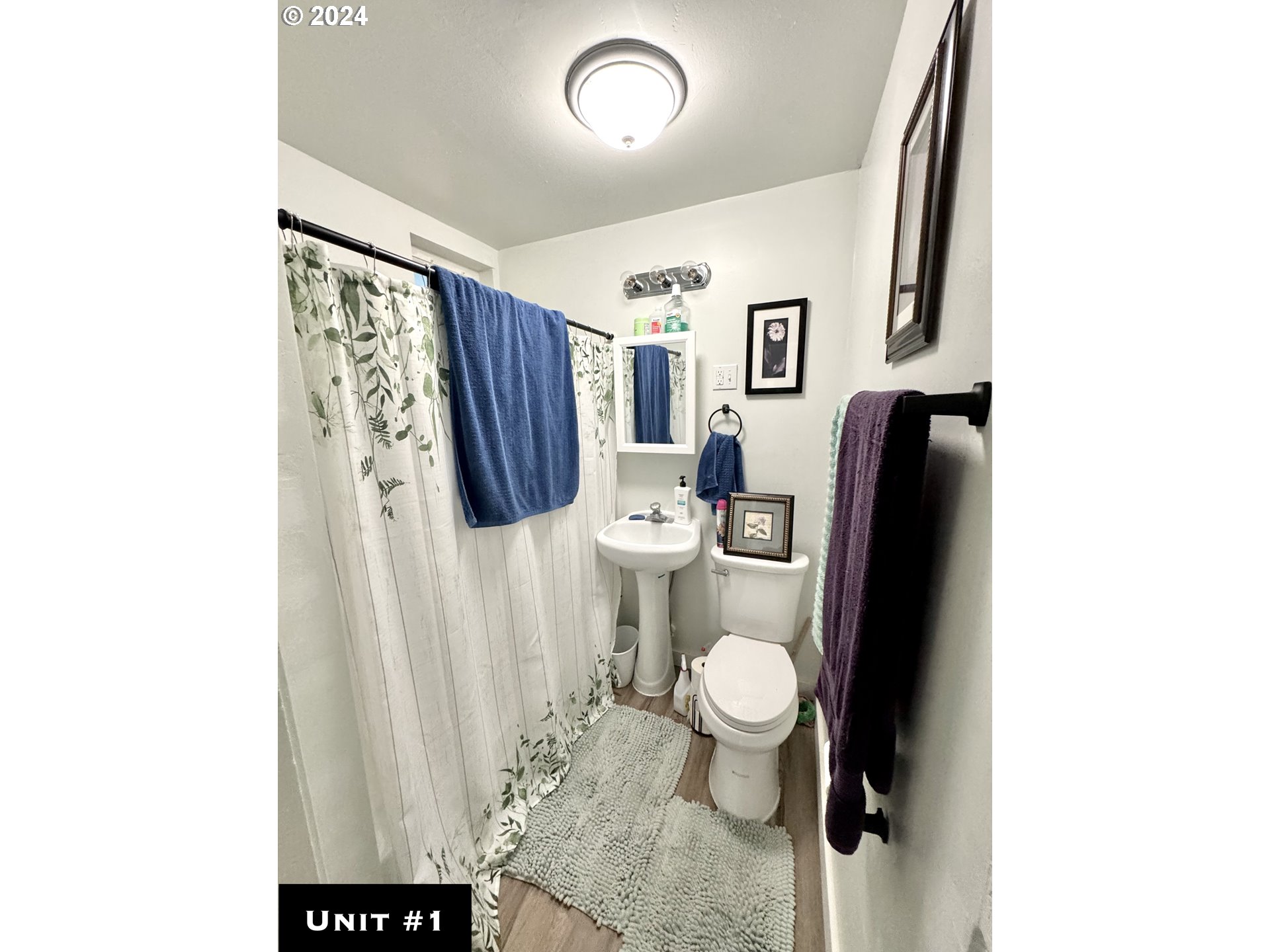 1032 South 4th Street Coos Bay, OR 97420 - Photo 11 of 44 a bathroom with a sink toilet and mirror