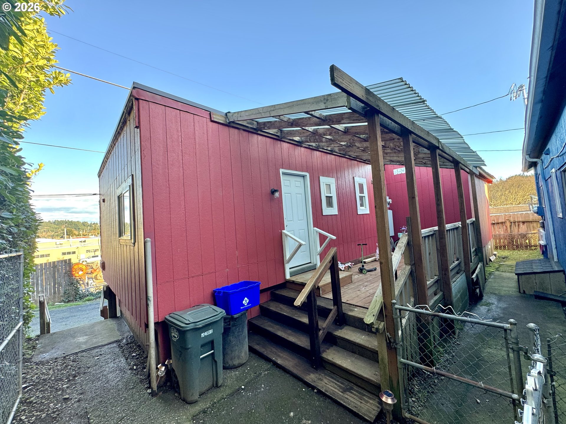 1032 South 4th Street Coos Bay, OR 97420 - Photo 22 of 44 a view of a backyard with furniture and outdoor seating