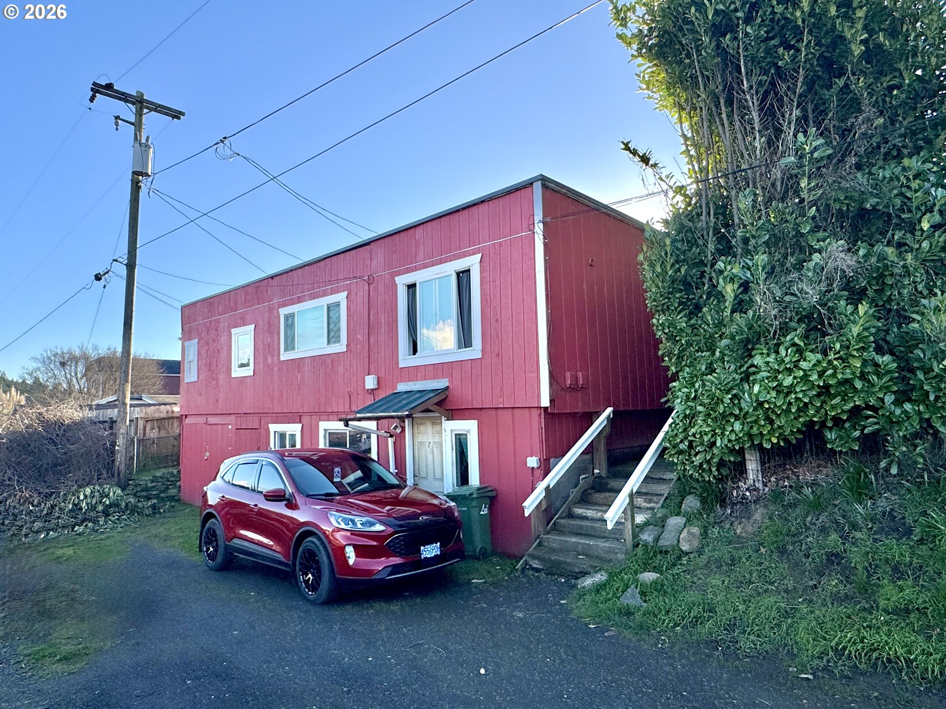1032 South 4th Street Coos Bay, OR 97420 - Photo 25 of 44 a front view of a house with parking space