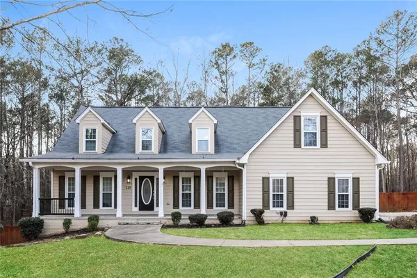 a front view of a house with garden
