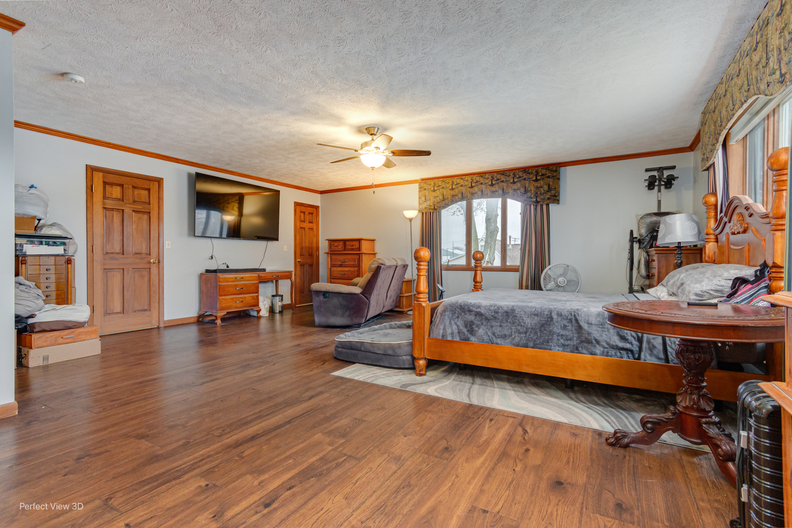 929 Lincoln Street Minonk, IL 61760 - Photo 14 of 26 a bedroom with a bed and wooden floor