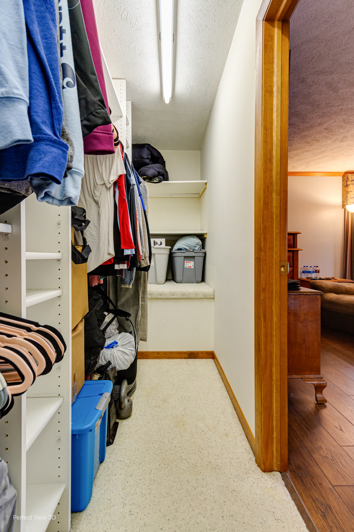 929 Lincoln Street Minonk, IL 61760 - Photo 18 of 26 a view of walk in closet with clothes and shoes