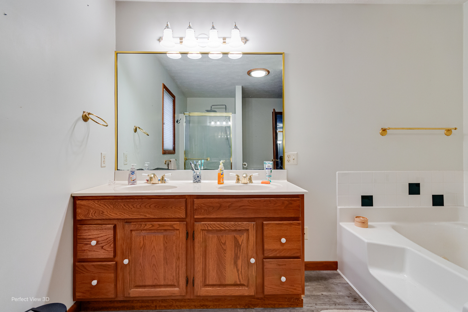929 Lincoln Street Minonk, IL 61760 - Photo 20 of 26 a spacious bathroom with a tub double sink and mirror