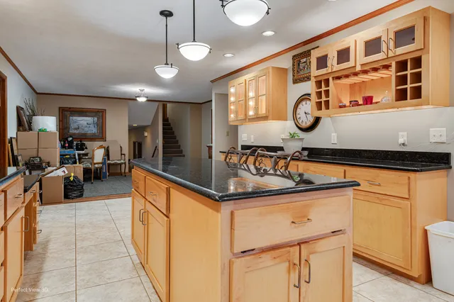 a kitchen with stainless steel appliances granite countertop a sink and cabinets