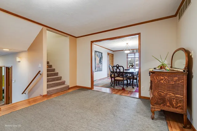 a view of a livingroom with furniture and entryway