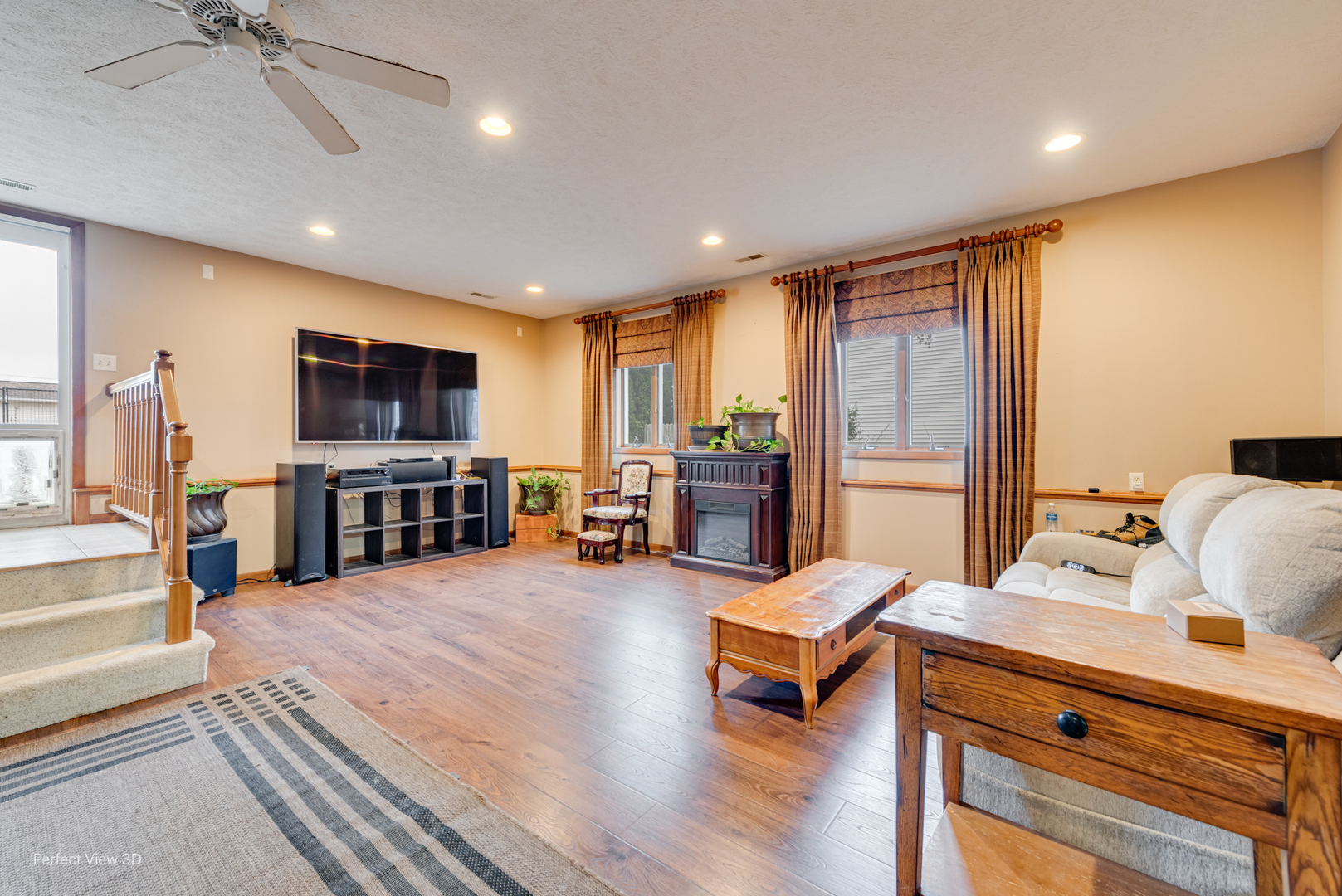 929 Lincoln Street Minonk, IL 61760 - Photo 8 of 26 a living room with furniture and a flat screen tv