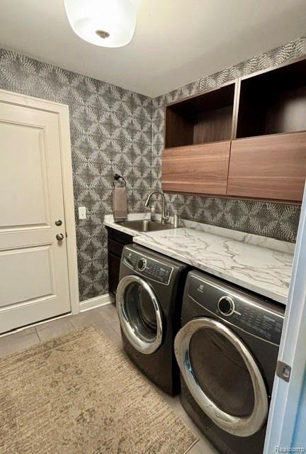 1876 Genoa Circle Howell, MI 48843 - Photo 12 of 36 Dedicated laundry room featuring a utility sink, countertop, and built-in cabinetry