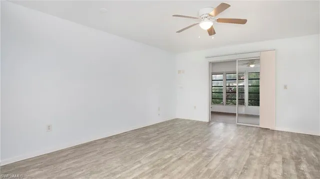 a living room with furniture window and a flat screen tv