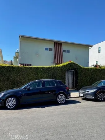 a car parked in front of a house