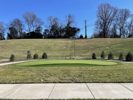 a view of a lake with a yard