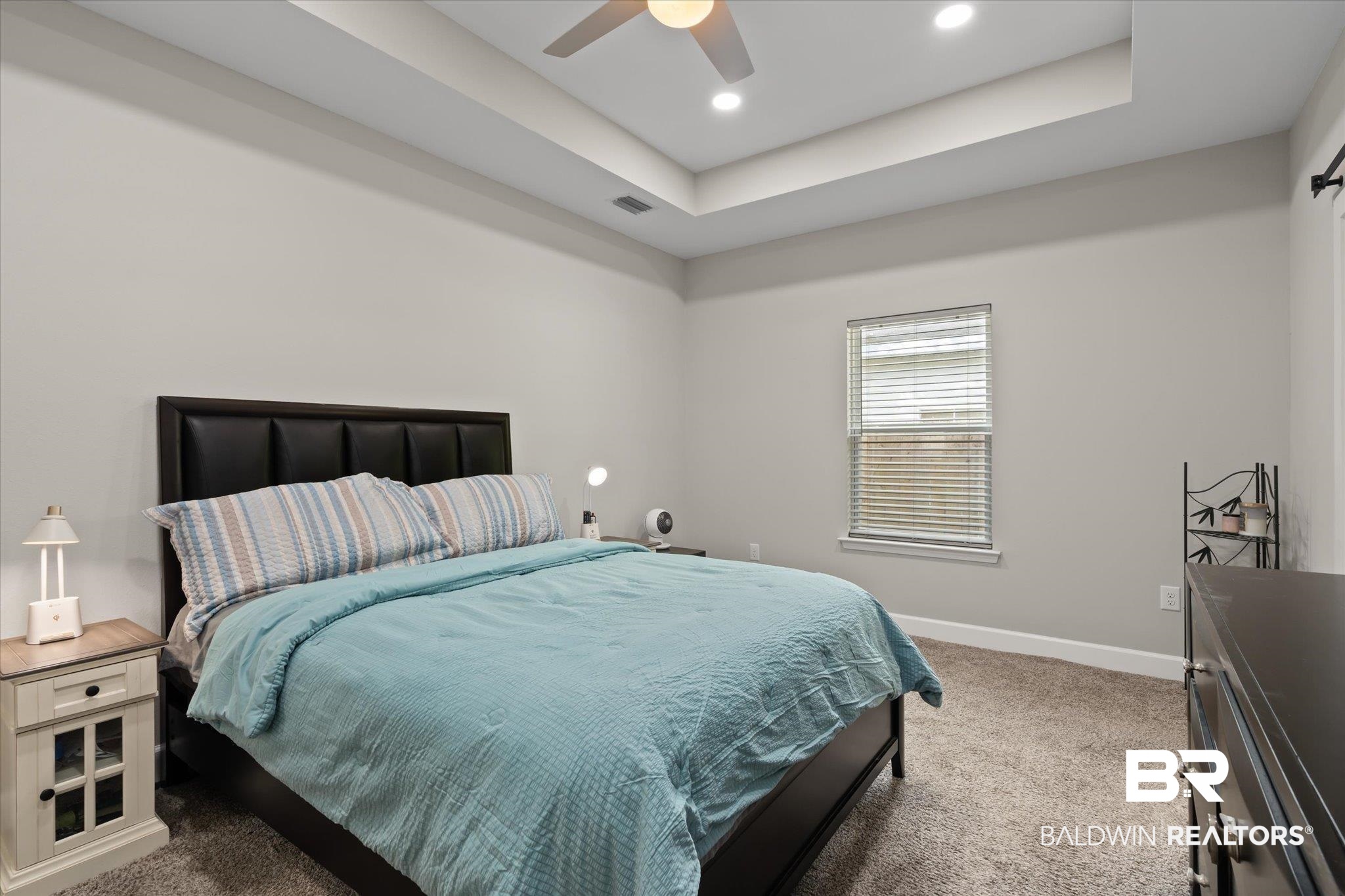 708 Fisher Street Mobile, AL 36607 - Photo 10 of 17 Bedroom featuring carpet flooring, ceiling fan, and a raised ceiling
