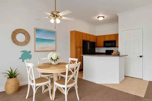 a dining room with furniture and window