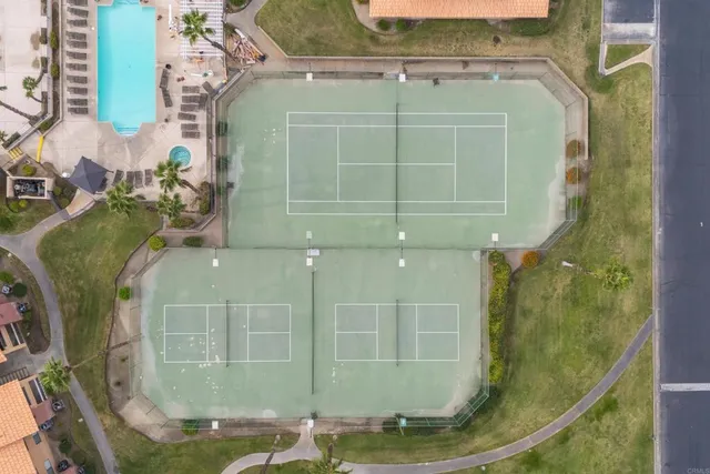 a view of a house with backyard swimming pool and sitting area