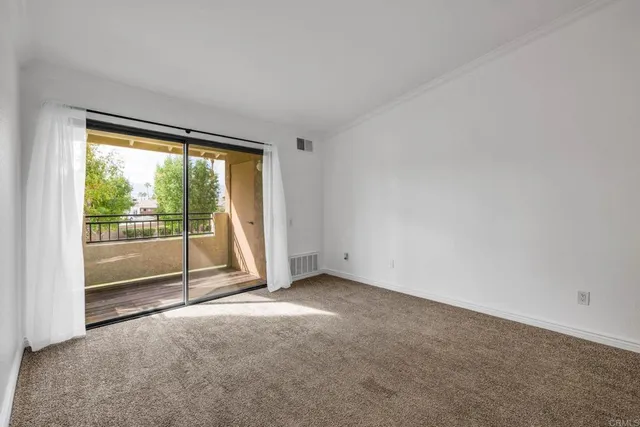 a view of empty room with floor to ceiling window