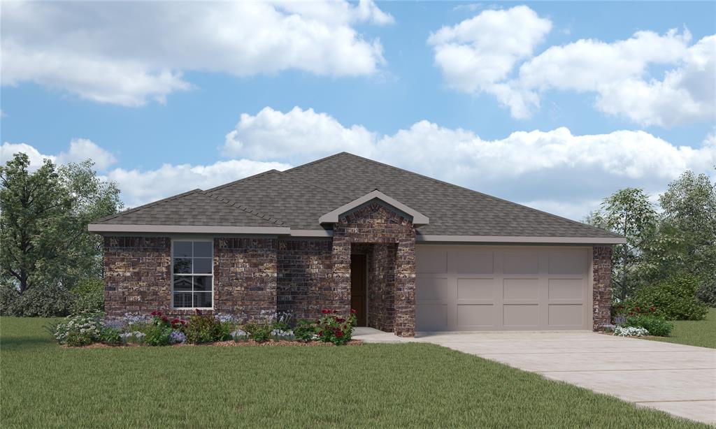 a front view of a house with a garden and yard