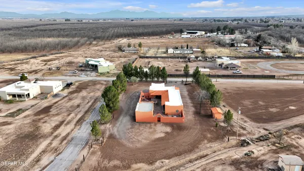 an aerial view of a house with outdoor space