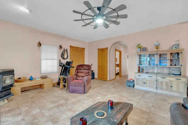 a bedroom with furniture and a chandelier