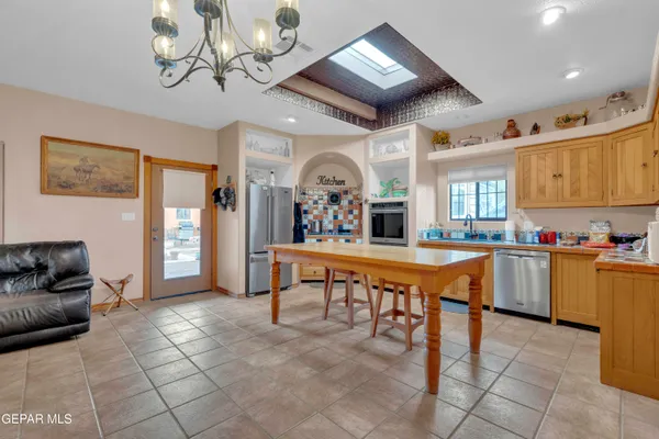 a view of a living room and chandelier