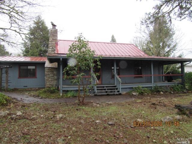 2151 Valley Road Willits, CA 95490 - Photo 1 of 1 a view of a house with a yard and garage
