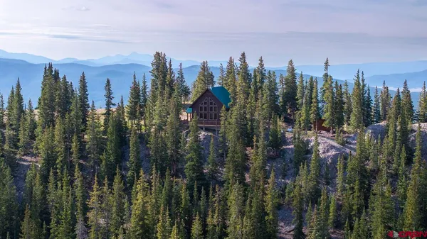 a view of a lake in between two of trees