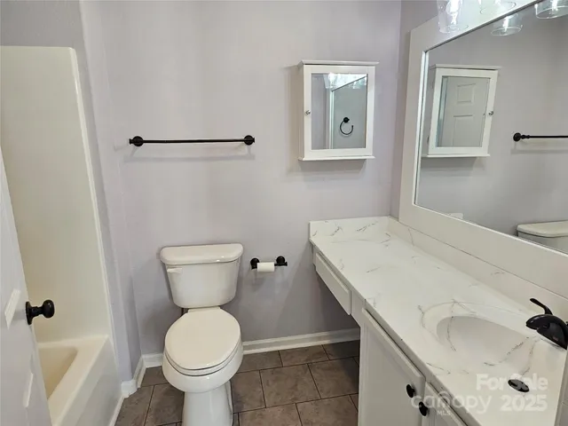 a bathroom with a sink and toilet