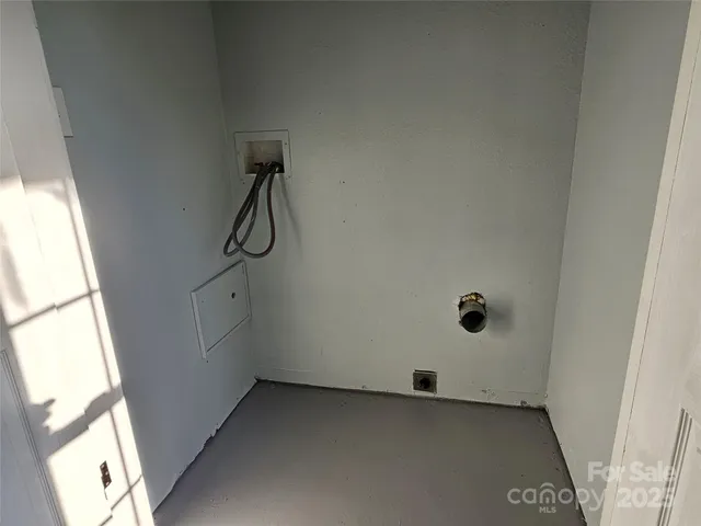 a view of an empty room with windows