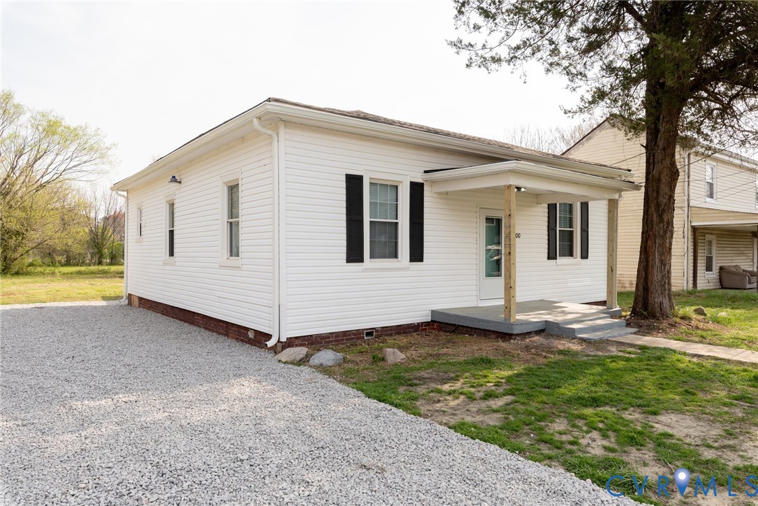 9800 Golf Course Drive Disputanta, VA 23842 - Photo 1 of 19 front view of a house with a yard