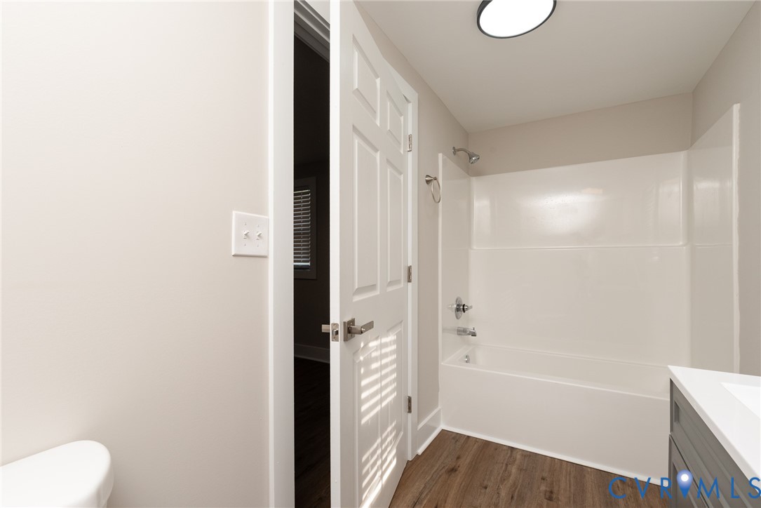 9800 Golf Course Drive Disputanta, VA 23842 - Photo 16 of 19 a bathroom with a bathtub and a shower