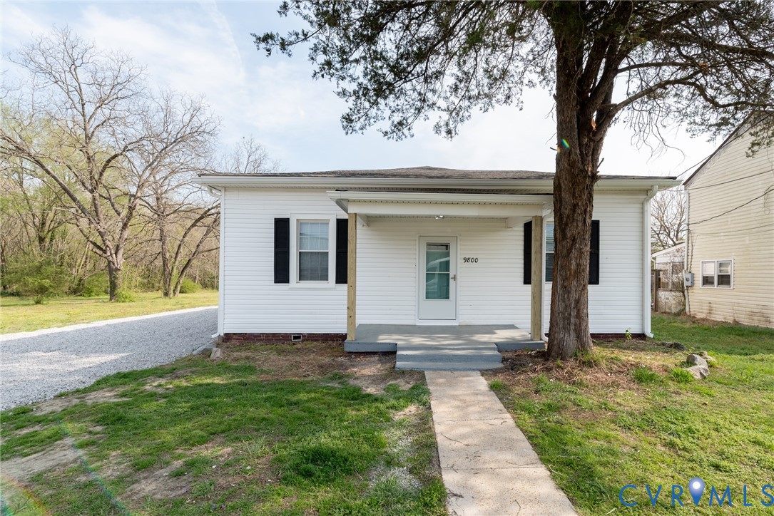 9800 Golf Course Drive Disputanta, VA 23842 - Photo 2 of 19 a view of a house with a yard