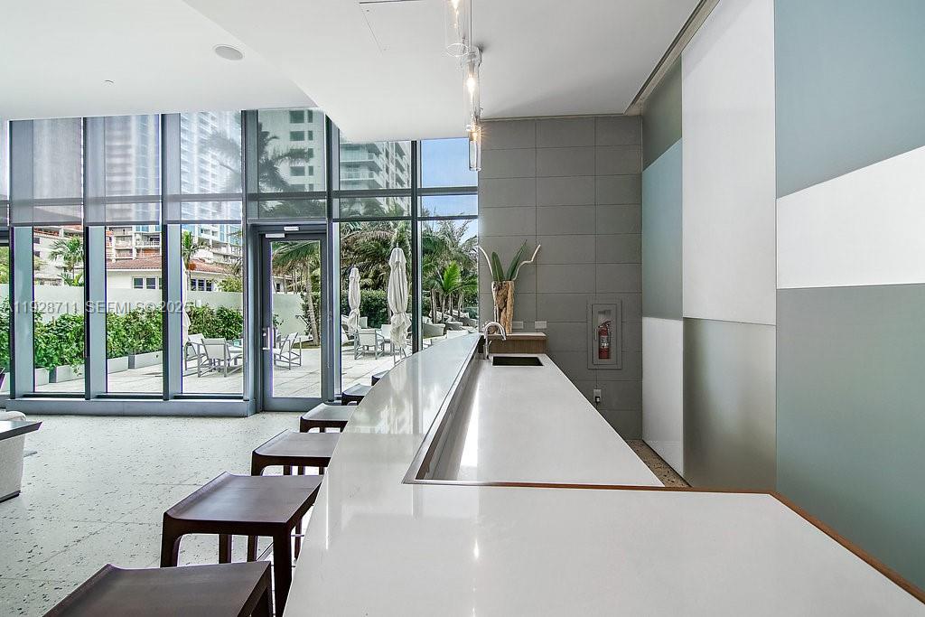 460 Northeast 28th Street, Unit 3904 Miami, FL 33137 - Photo 51 of 54 a living room with furniture and a floor to ceiling window