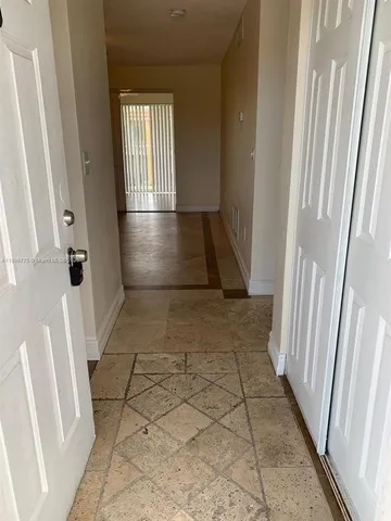 a view of entryway with stairs and a window