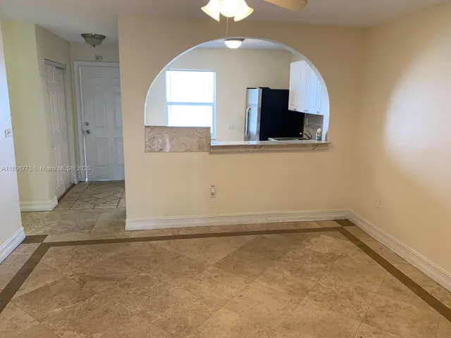 a view of a room with a fireplace and a chandelier