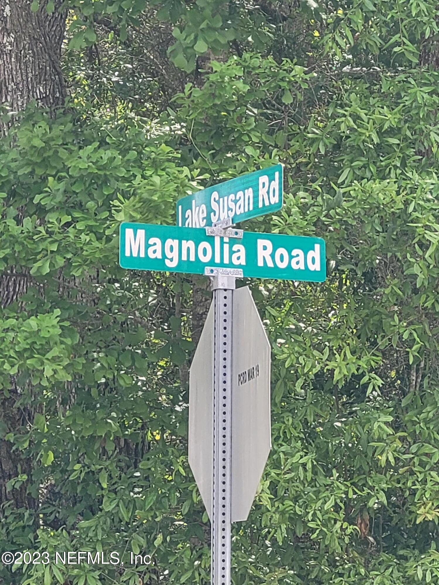 Lot 10 Magnolia Road Hawthorne, FL 32640 - Photo 3 of 7 a sign board with a tree in the background